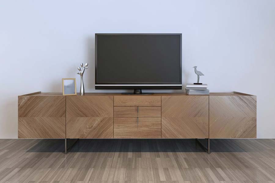 télévision disposée sur un meuble en bois